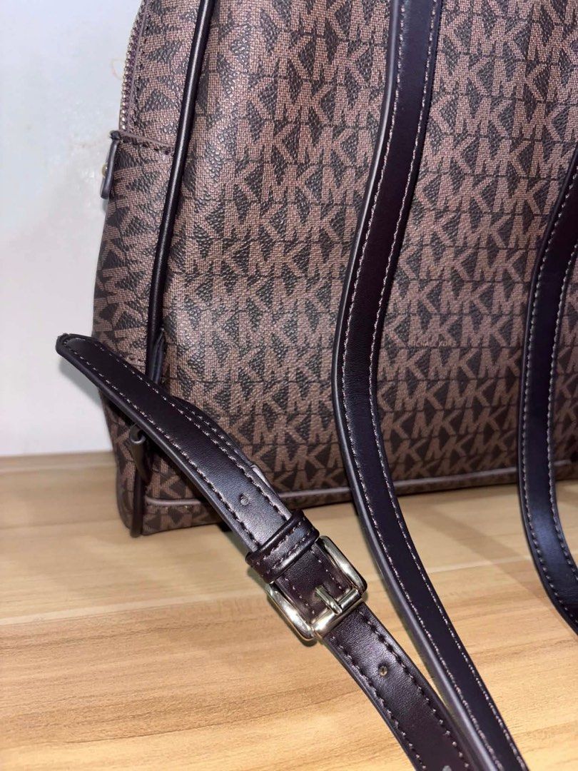 Michael Kors Rhea Backpack Brown (Category: Backpacks) located in Angeles City. Submitted by cullengray (Listing ID 1469469487, Image 3). Description: Signature Logo Backpack Brown Crafted from logo-print coated canvas with durable trim and gold-tone hardware; features a YKK zip closure made in Vietnam. • Secured zip fastening with a fully lined polyester interior for everyday organization. • Designed with a front exterior zip pocket and an inter