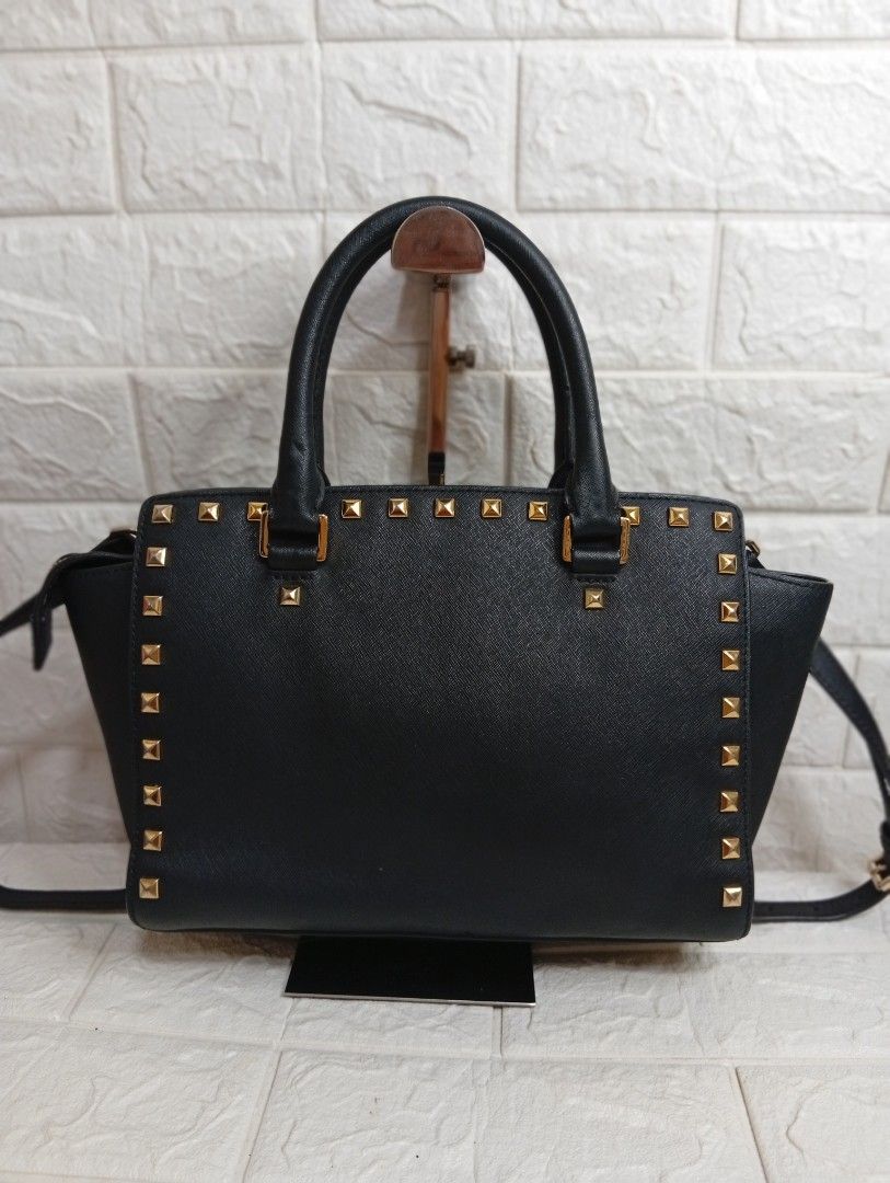 Michael Kors Selma Stud Medium Satchel Bag (Category: Cross-body Bags) located in Las Pinas. Submitted by etoksi1234 (Listing ID 1469558297, Image 2). Description: Michael Kors Selma Stud medium satchel Bag. Crafted from structured Saffiano leather with gold-tone pyramid stud accents, dual top handles, and a detachable shoulder strap..