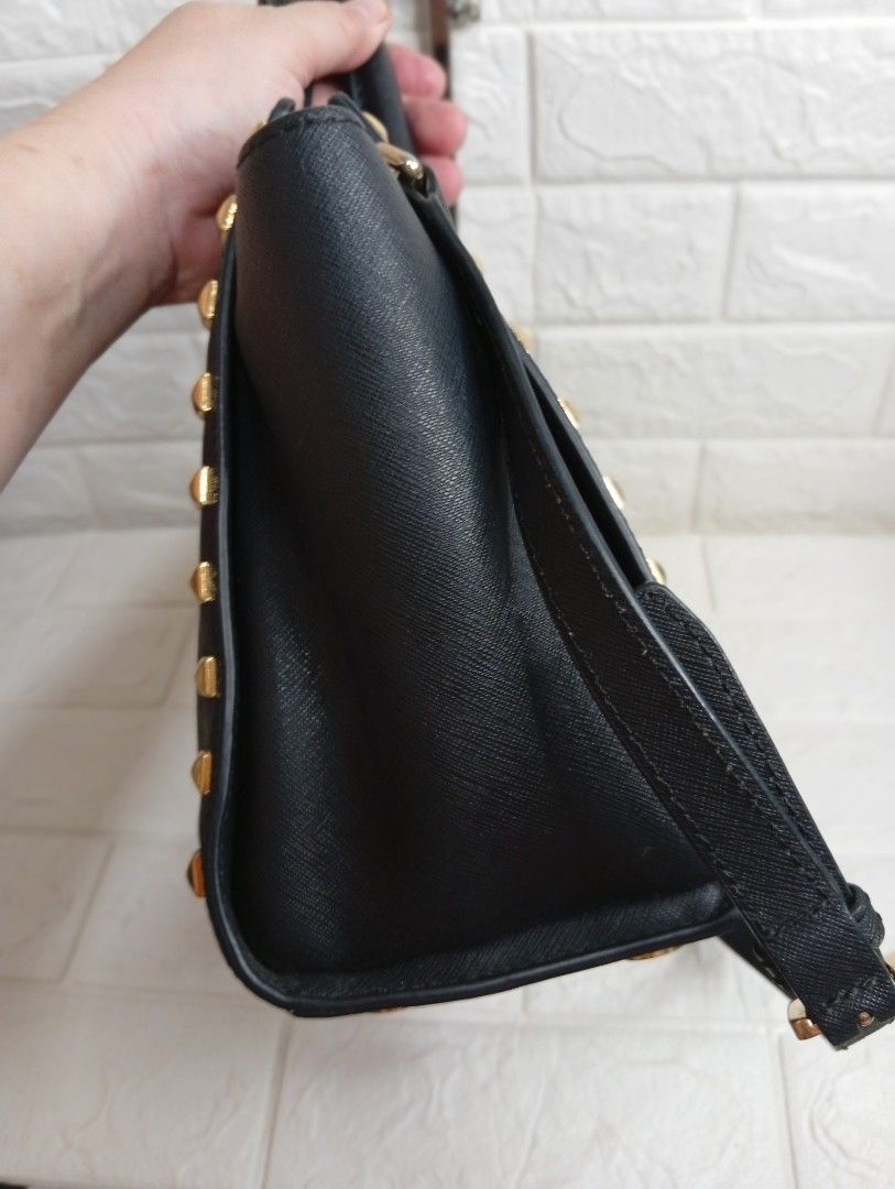 Michael Kors Selma Stud Medium Satchel Bag (Category: Cross-body Bags) located in Las Pinas. Submitted by etoksi1234 (Listing ID 1469558297, Image 3). Description: Michael Kors Selma Stud medium satchel Bag. Crafted from structured Saffiano leather with gold-tone pyramid stud accents, dual top handles, and a detachable shoulder strap..