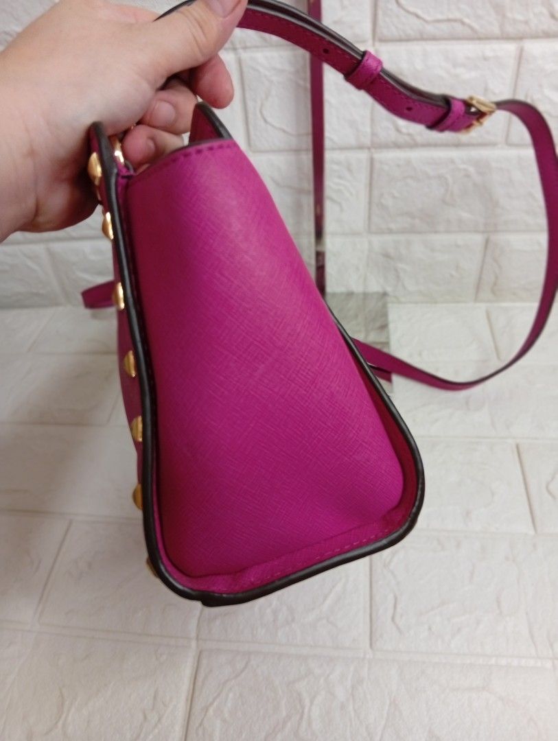 Michael Michael Kors Selma Medium Studded Sling Bag, (Category: Cross-body Bags) located in Las Pinas. Submitted by etoksi1234 (Listing ID 1469558100, Image 3). Description: Pre-loved Michael Michael Kors Selma Medium Studded Sling Bag, accented with gold-tone hardware, pyramid studs along the sides, and the signature Michael Kors logo lettering on the front. Inside lining need wash..