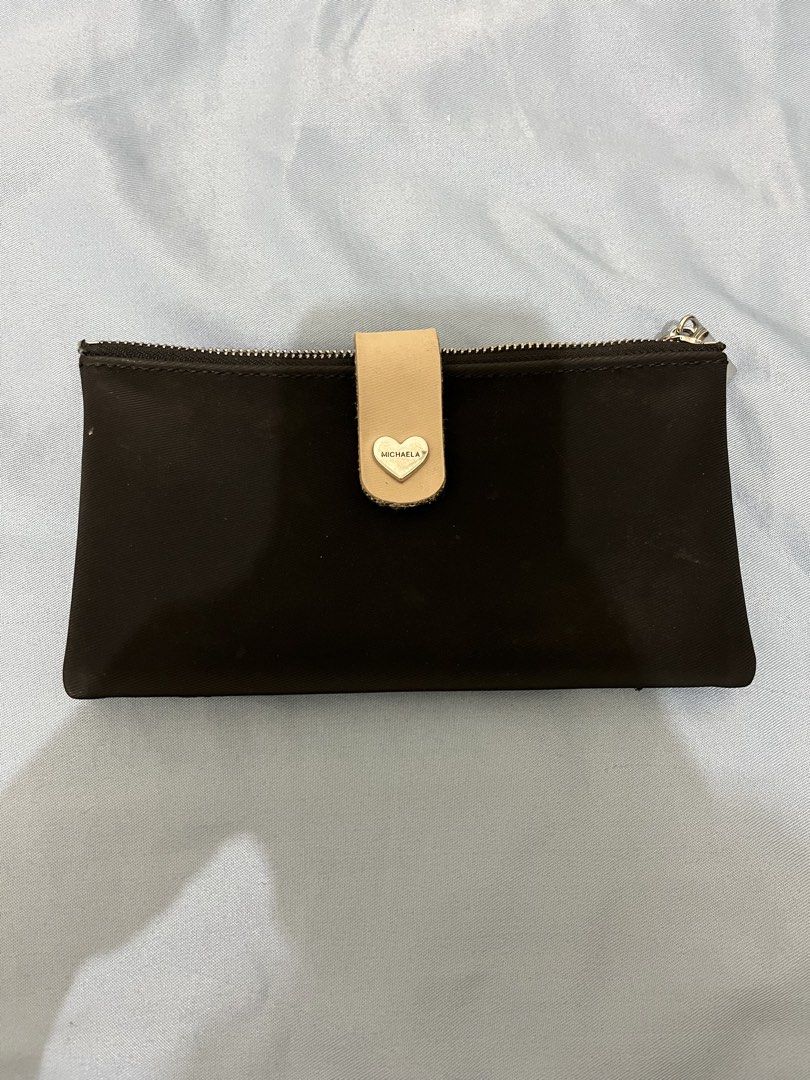 Michaela Black Double Zipper Wallet (Category: Wallets & Card holders) located in Angeles City. Submitted by melloromi (Listing ID 1469551342, Image 1). Description: Condition: -still in good condition -has washable stain -peeling on some inner card slots due to wear and tear. Still usable..