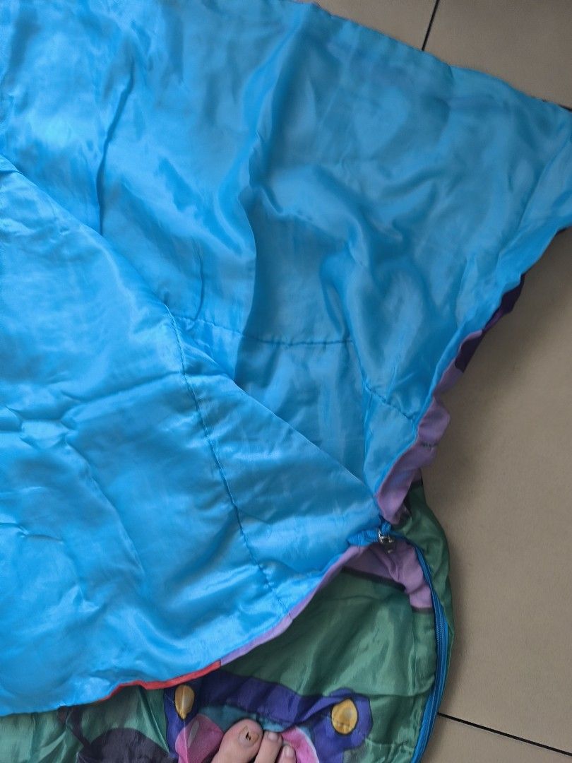 Mickey mouse sleeping bag for kids (Category: Travel Essentials & Accessories) located in Manila. Submitted by lianlim.mail (Listing ID 1469425904, Image 2). Description: declutter Mickey mouse sleeping bag for kids 145x76cm needs wash (amoy cabinet). no stain..