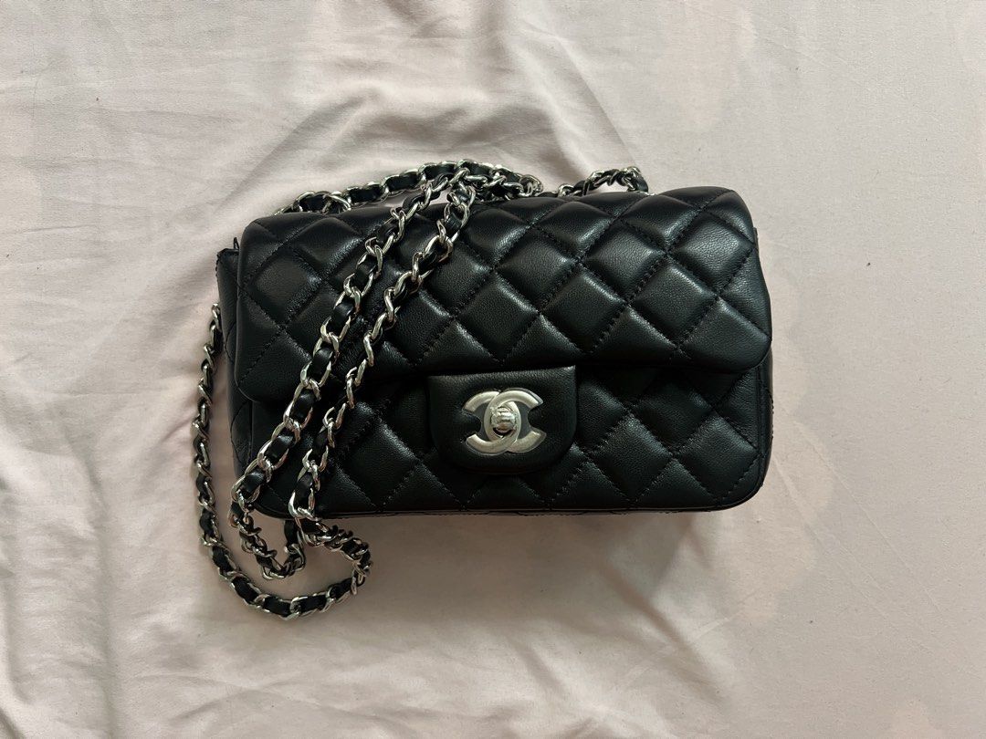Mini Classic Flap Bag Black Silver Hardware (Category: Luxury Bags & Wallets) located in Cagayan de Oro. Submitted by mingkymouse (Listing ID 1469448877, Image 1). Description: MINI-sized — 20cm - Black quilted leather flap bag; lambskin leather - SUCH A GOOD QUALITY LEATHER; feels super soft and plush 😩 - Silver chain strap (can be worn long or doubled up) - Turn-lock closure - Comes with box and dustbag - Can send more photos for sure buyers �