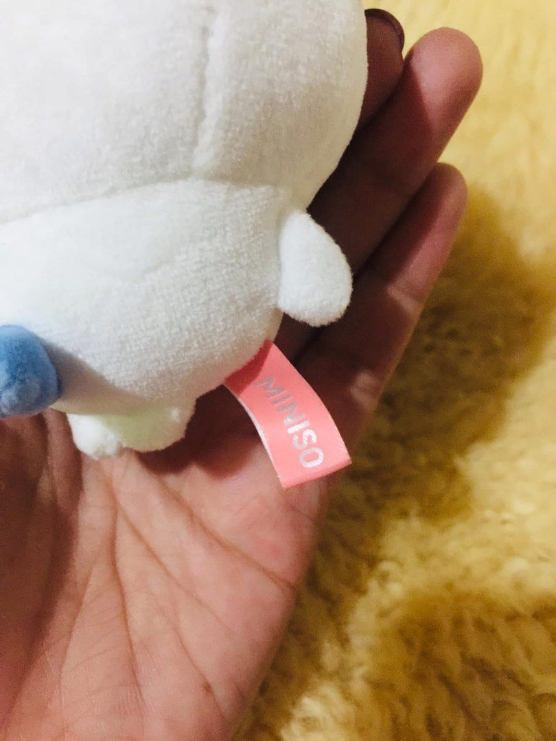 Miniso Chiikawa Hachiware Plush Keychain Bag Charm (Category: Plushies & Soft Toys) located in Baguio. Submitted by izza_thrifty (Listing ID 1469567414, Image 2). Description: - Official Miniso x Chiikawa collaboration plush keychain - Character: Hachiware (white body with blue cat ears and embroidered blush) - Includes silver-coloured ball chain for easy hanging on bags or keys - Features official Miniso and Chiikawa branding tag on the side - C