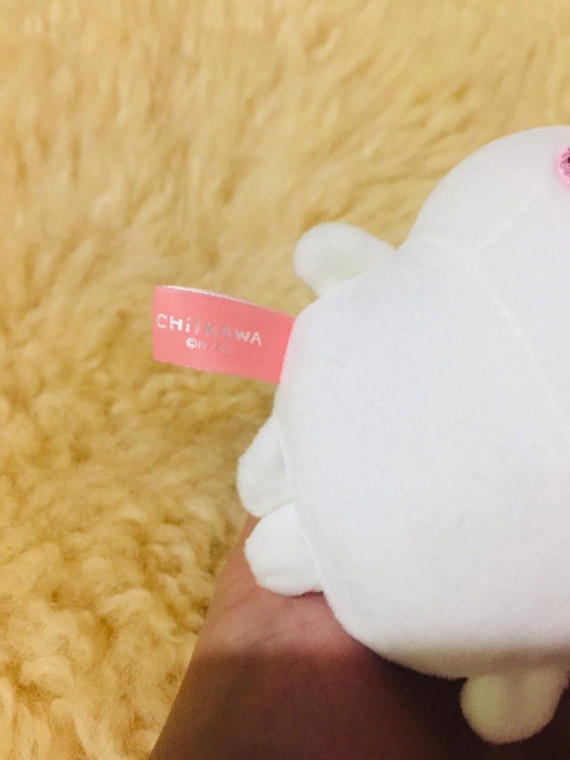 Miniso Chiikawa Hachiware Plush Keychain Bag Charm (Category: Plushies & Soft Toys) located in Baguio. Submitted by izza_thrifty (Listing ID 1469567414, Image 3). Description: - Official Miniso x Chiikawa collaboration plush keychain - Character: Hachiware (white body with blue cat ears and embroidered blush) - Includes silver-coloured ball chain for easy hanging on bags or keys - Features official Miniso and Chiikawa branding tag on the side - C