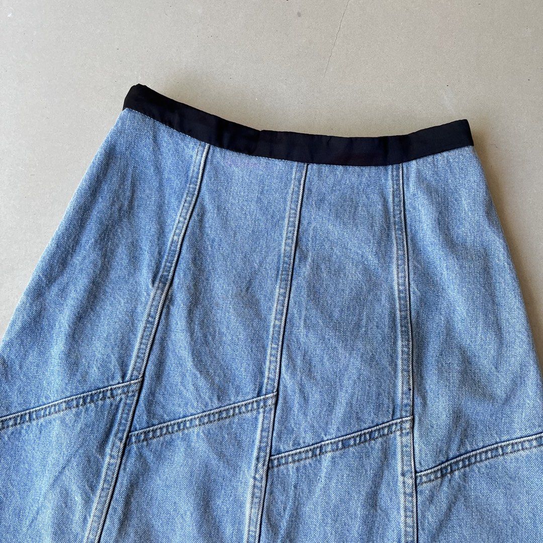 Miu Miu Denim Skirt (Category: Skirts) located in Mandaue City. Submitted by chinsyap_03 (Listing ID 1469468561, Image 2). Description: - Brand: Miu Miu - Origin: Made in Italy - Size: 36 - Wash: Light wash denim - Details: Contrast black waistband, panelled construction, raw frayed hem - Closure: Side zip - Style: Classic vintage piece, highly versatile and easy to pair with tees or knits.