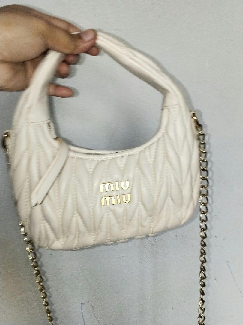Miumiu White (Category: Cross-body Bags) located in Manila. Submitted by bagelyascollection (Listing ID 1469503959, Image 3). Description: Miumiu small size white color cutey.