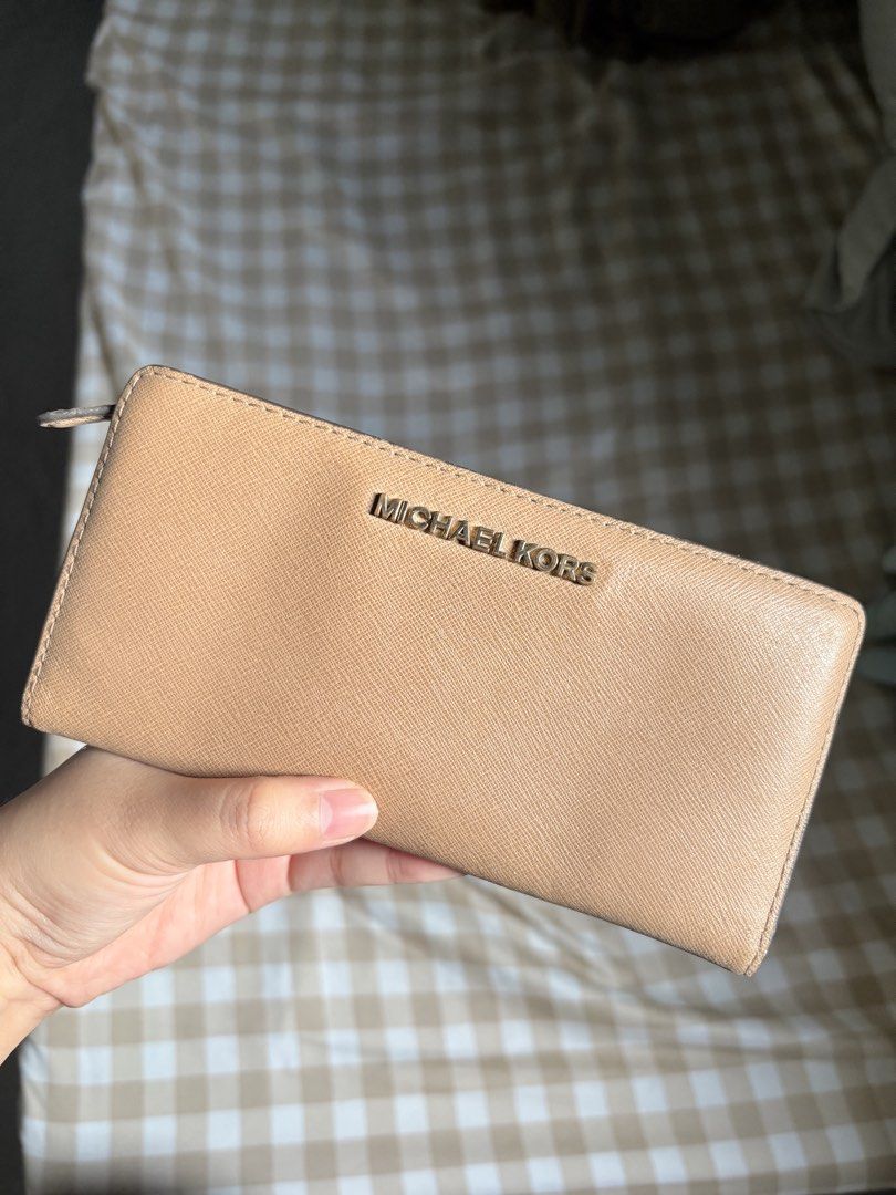 MK LONG WALLET (Category: Wallets & Card holders) located in San Marcelino. Submitted by abyanggg (Listing ID 1469570896, Image 1). Description: MK long wallet Bought in Guam Scratches Needs cleaning Working zipper.
