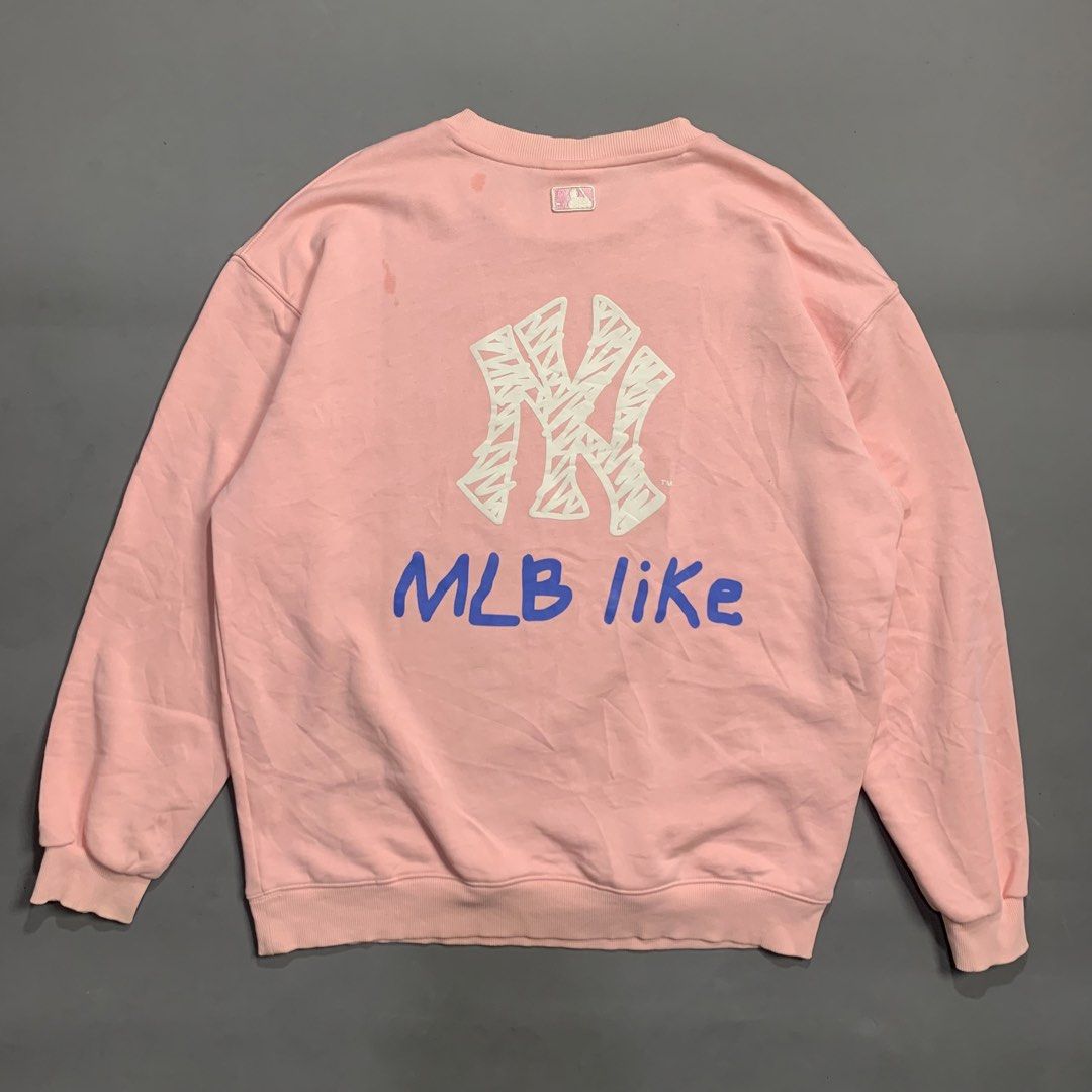 MLB New York Yankees Pink Sweatshirt (Category: Coats, Jackets and Outerwear) located in Kalibo. Submitted by gneiss2002 (Listing ID 1469528476, Image 2). Description: - Authentic pink MLB New York Yankees sweatshirt - Classic crewneck design with ribbed collar, cuffs, and hem - Small textured embroidered NY logo on the left chest - Soft cotton blend interior for everyday warmth and comfort - Relaxed fit through the body and sleeves.