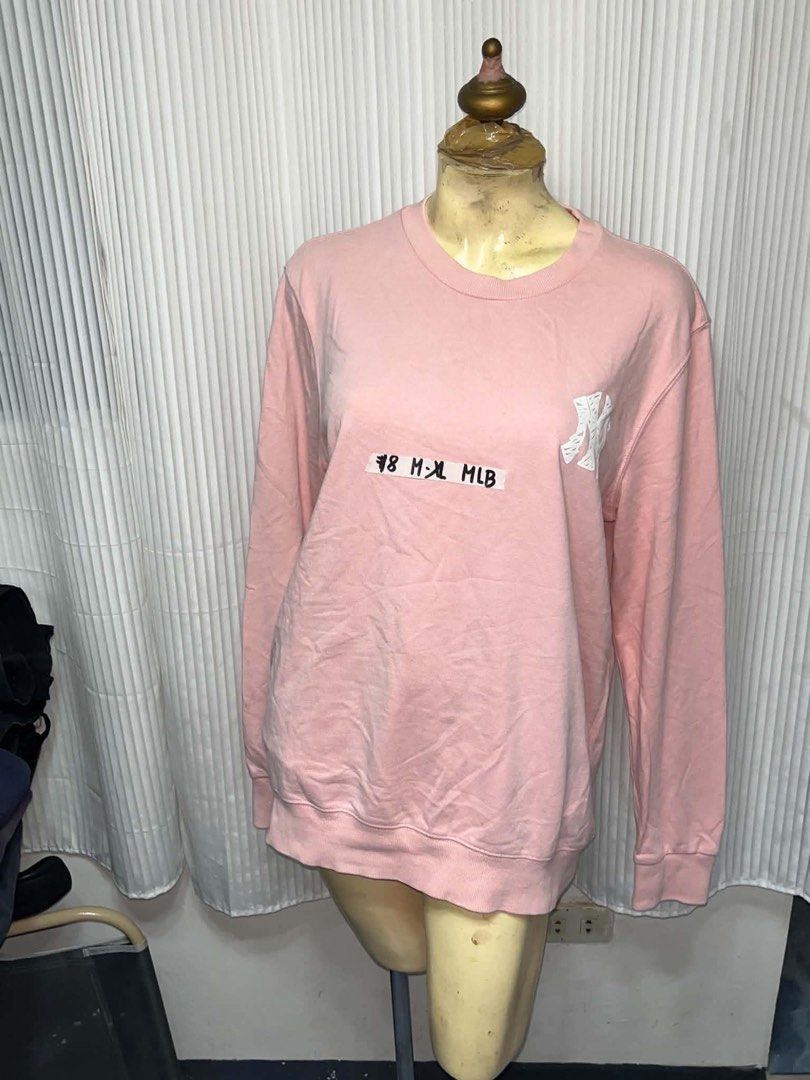 MLB Pink Yankees Crewneck Sweatshirt (Category: Coats, Jackets and Outerwear) located in General Trias. Submitted by crissy9053136 (Listing ID 1469446018, Image 1). Description: - Color: Pink - Brand/Team: New York Yankees (MLB) - Design: Small logo on chest, large graphic and lettering on the back - Fit: Relaxed, oversized fit - Material: Cozy fleece - Style: Casual and easy to style.