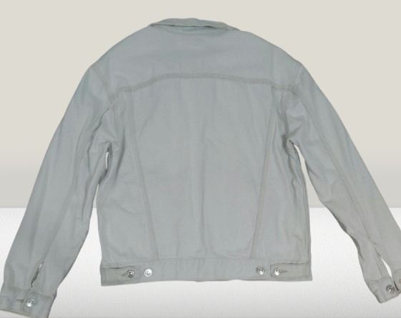 MNG Light Wash Denim Jacket (Category: Coats, Jackets and Outerwear) located in Davao. Submitted by rosewyn (Listing ID 1469468468, Image 2). Description: - Brand: MNG - Color: White (clean light wash) - Closure: Button-up front with metallic hardware - Pockets: 2 chest flap pockets and 2 side welt pockets - Details: Subtle light stitching throughout - Fit: Approximately 18 inches shoulder width - Condition: Excellent, ready to wear over any casu