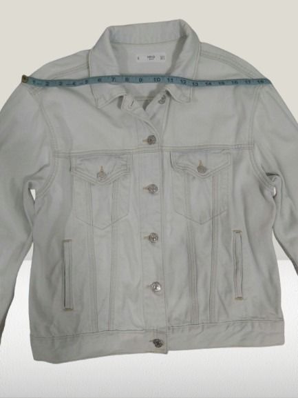 MNG Light Wash Denim Jacket (Category: Coats, Jackets and Outerwear) located in Davao. Submitted by rosewyn (Listing ID 1469468468, Image 3). Description: - Brand: MNG - Color: White (clean light wash) - Closure: Button-up front with metallic hardware - Pockets: 2 chest flap pockets and 2 side welt pockets - Details: Subtle light stitching throughout - Fit: Approximately 18 inches shoulder width - Condition: Excellent, ready to wear over any casu