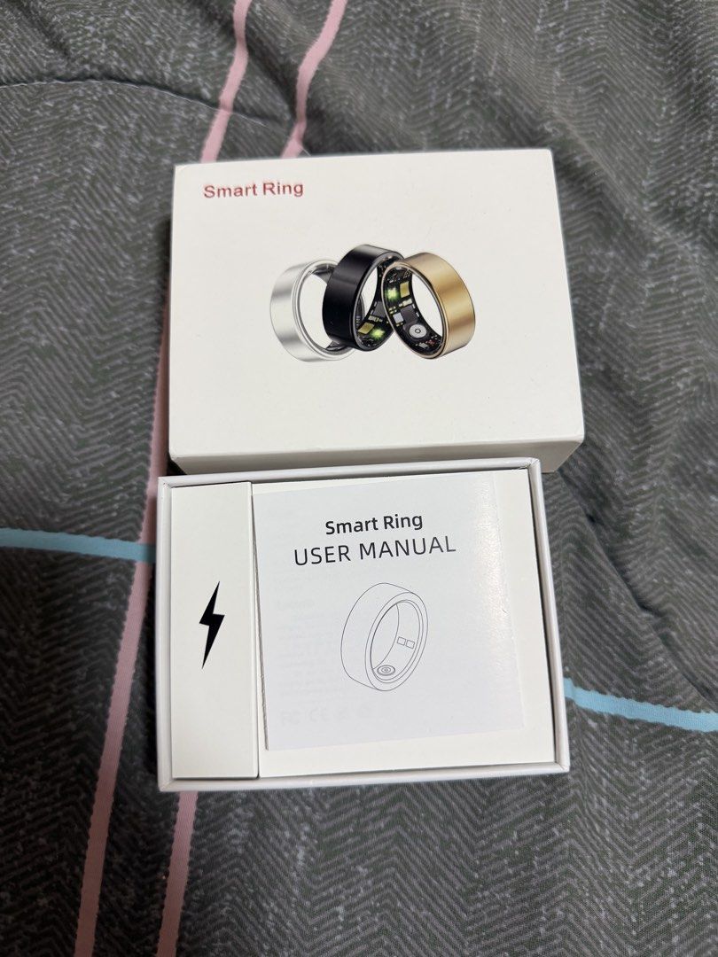 Modofo Smart Ring (Category: Wearables & Smart Watches) located in Binan City. Submitted by alreadyloved.p (Listing ID 1469530328, Image 2). Description: - Brand: Modofo SIZE 8 - Product: Smart Ring - Color: Gold - Condition: Brand new in box - Includes: Smart ring, charging cable, and user manual - Features: Sleek design, fitness and health tracking capabilities.