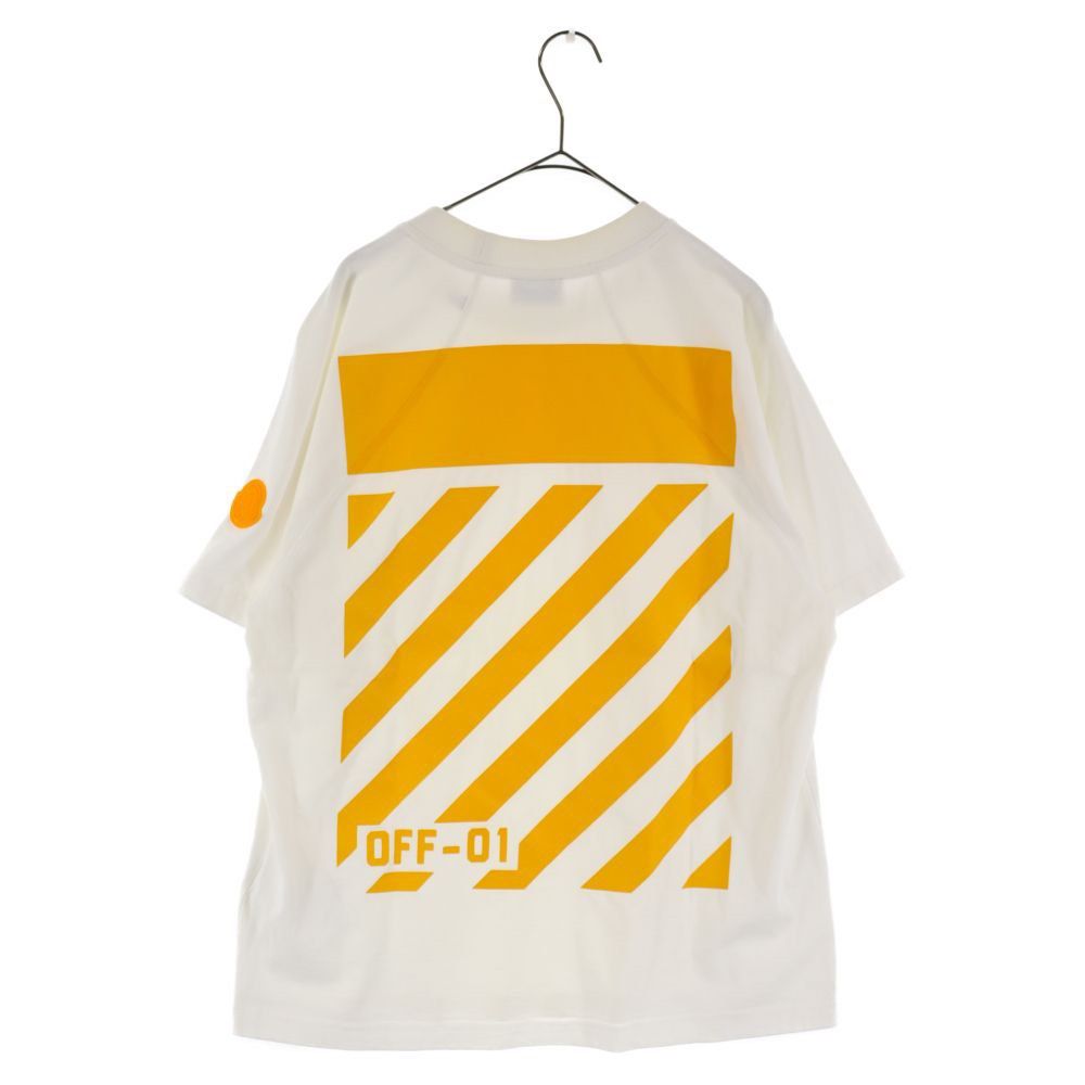 Moncler White Yellow Graphic Tee (Category: Tshirts & Polo Shirts ) located in Manila. Submitted by vjalejandr35483 (Listing ID 1469462600, Image 2). Description: - Authentic Moncler white t-shirt - Bold yellow diagonal stripes and branding block printed on the back - Matching orange-yellow rubber Moncler logo patch on the sleeve - Clean minimalist front with a subtle faded graphic - Ribbed crew neck and comfortable raglan sleeve construction - S