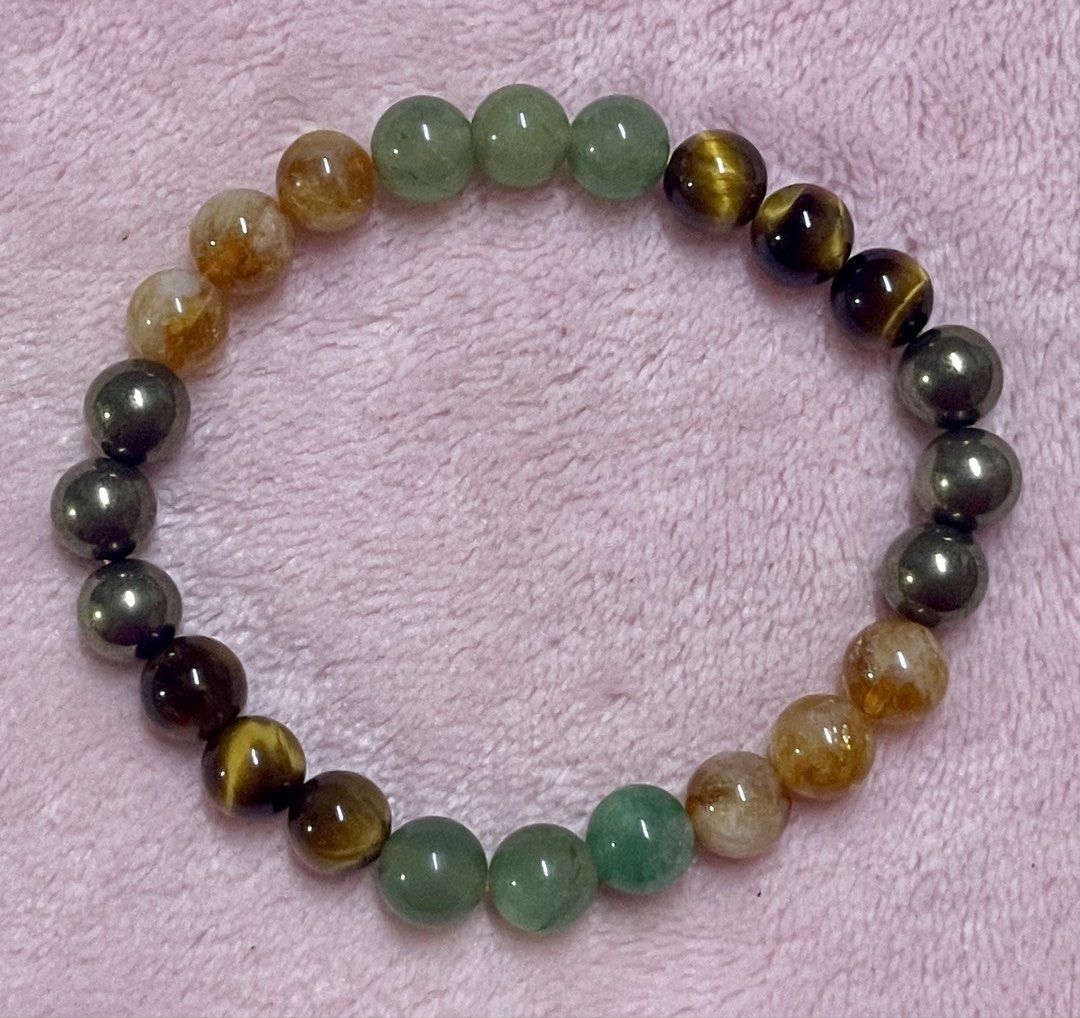 Money Magnet Bracelet 8mm (Category: Bracelets) located in Manila. Submitted by Crystal_Oracle (Listing ID 1469506706, Image 2). Description: A money magnet bracelet is an accessory made with natural gemstones—most commonly Pyrite, Citrine, Green Aventurine, and Tiger’s Eye—believed in crystal healing and metaphysical practices to attract wealth, foster an abundance mindset, and invite new financial opportunities. Common Stones and Their Meanings