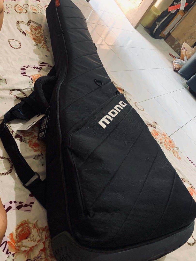 MONO M80 Vertigo Bass Guitar Case (Category: Musical Instruments) located in Caloocan City. Submitted by barbernard23857 (Listing ID 1469569717, Image 1). Description: No issue - Brand: MONO M80 Vertigo Bass Guitar Gig Bag - Color: Black with plush grey interior lining - Condition: Brand new with tag still attached the handle - Design: Convenient top-loading design for easy access - Protection: Rugged exterior shell built for serious transport an