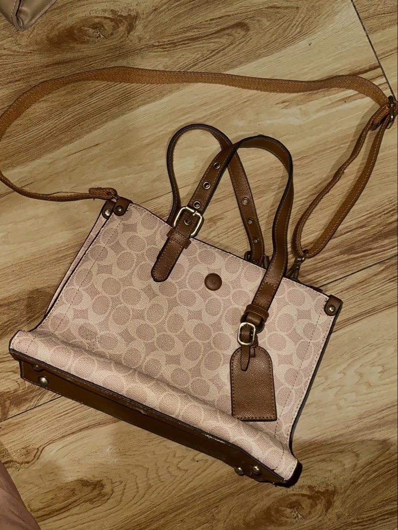 Monogram Pattern Tote Bag with Shoulder Strap (Category: Tote Bags) located in Manila. Submitted by tenshiii185 (Listing ID 1469430826, Image 1). Description: - Design: Stylish brown monogram pattern with faux leather trim - Carrying Options: Dual top handles and an adjustable, removable shoulder strap - Hardware: Elegant gold-tone hardware throughout - Compartments: Central zipped compartment dividing two main sections, plus an extra inner zip p