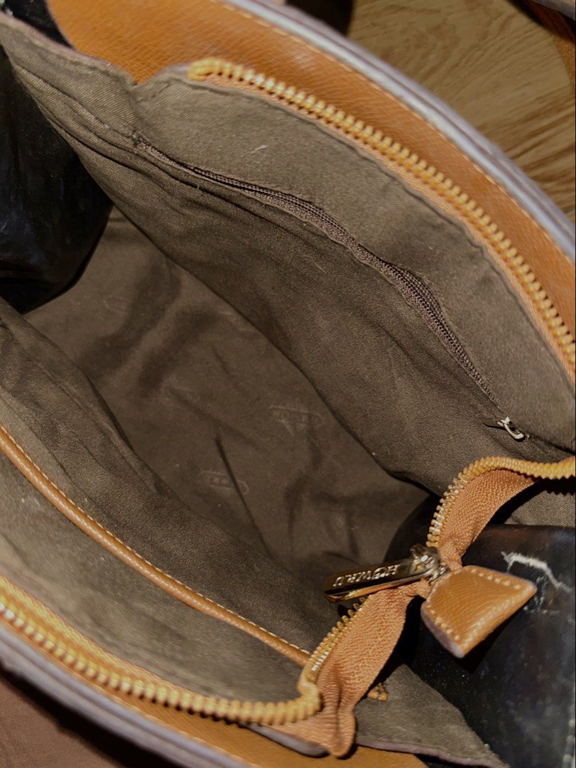 Monogram Pattern Tote Bag with Shoulder Strap (Category: Tote Bags) located in Manila. Submitted by tenshiii185 (Listing ID 1469430826, Image 2). Description: - Design: Stylish brown monogram pattern with faux leather trim - Carrying Options: Dual top handles and an adjustable, removable shoulder strap - Hardware: Elegant gold-tone hardware throughout - Compartments: Central zipped compartment dividing two main sections, plus an extra inner zip p
