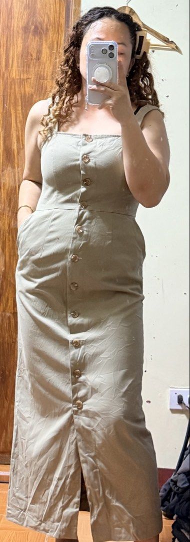 Moussy Beige Button-Down Midi Dress Size 2 (Category: Dresses) located in Paete. Submitted by skydruemadison (Listing ID 1469531107, Image 3). Description: - Brand: Moussy - Color: Classic beige - Size: 2(xs-semi med() - Length: Midi - Neckline: Square neckline with thick straps - Closure: Functional front button-down from top to bottom - Special Feature: Comes with convenient side pockets - Fit: Structured, body-hugging silhouette.