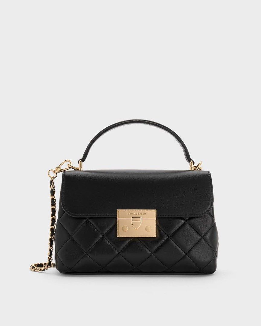 MPO Charles & Keith Alva Quilted Black Handbag (Category: Luxury Bags & Wallets) located in Cavite. Submitted by lovedbypriley (Listing ID 1469430859, Image 1). Description: - Mall Pull-out Charles & Keith Alva Quilted Hand bag - Color: Classic Black - Hardware: Gold-tone front flap closure - Straps: Includes top handle and a mixed leather & chain shoulder strap - Size: Medium (spacious yet compact) - Condition: Excellent / Well-maintained.