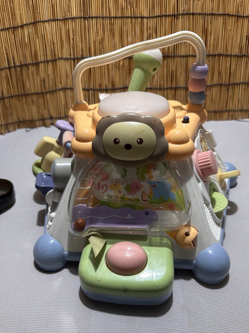 Multi-activity baby learning cube toy with music and games (Category: Infant Playtime) located in Cainta. Submitted by mochimochiko (Listing ID 1469417263, Image 3). Description: -As Is. WYSIWYG - Multi-sided interactive learning toy for toddlers - Features a built-in microphone, cash register, sliding elements, beads, and buttons on every side - Bright and colorful design to keep young kids engaged - Convenient top handle for easy carrying.