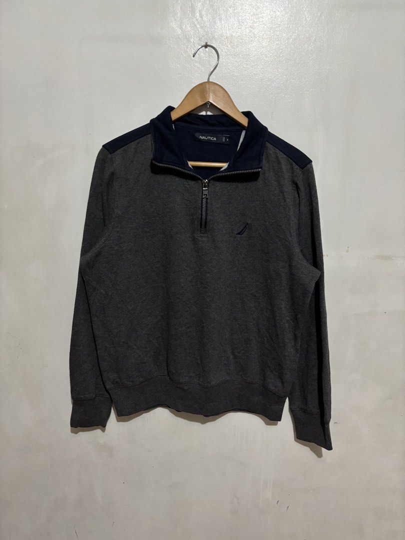 Nautica Grey Half-Zip Sweatshirt Size S (Category: Coats, Jackets and Outerwear) located in Manila. Submitted by jemiruxd (Listing ID 1469510133, Image 1). Description: - Brand: Nautica - Color: Grey with navy blue collar and shoulder panels - Size: Small - Details: Small embroidered sailboat logo on chest, branded metallic zipper pull - Features: Ribbed cuffs and hem - Condition: Good, made in Vietnam.