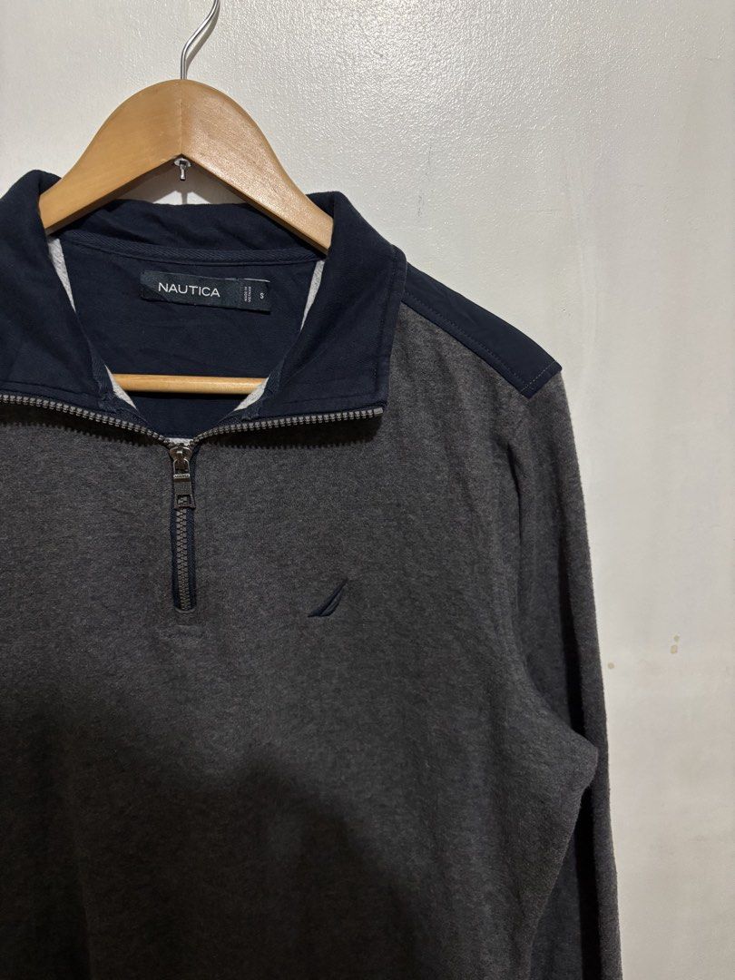 Nautica Grey Half-Zip Sweatshirt Size S (Category: Coats, Jackets and Outerwear) located in Manila. Submitted by jemiruxd (Listing ID 1469510133, Image 3). Description: - Brand: Nautica - Color: Grey with navy blue collar and shoulder panels - Size: Small - Details: Small embroidered sailboat logo on chest, branded metallic zipper pull - Features: Ribbed cuffs and hem - Condition: Good, made in Vietnam.