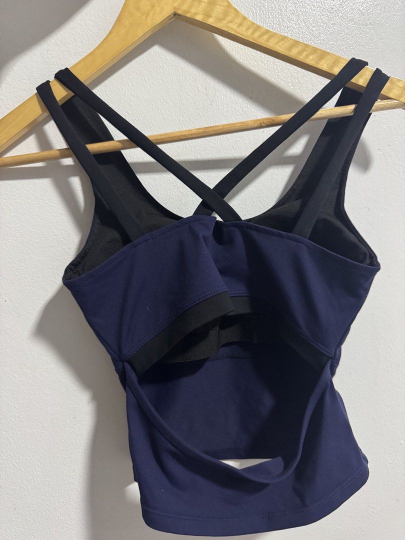 Navy Blue Activewear Crop Top Crisscross Straps (Category: Activewear) located in Manila. Submitted by decluterthings888 (Listing ID 1469427821, Image 2). Description: - Color: Navy blue - Design: Scoop neckline with stylish black crisscross back straps and open-back style - Support: Built-in shelf bra for added convenience - Fabric: Breathable, high-stretch material with clean stitching - Ideal for: Gym workouts, yoga sessions, or casual streetw