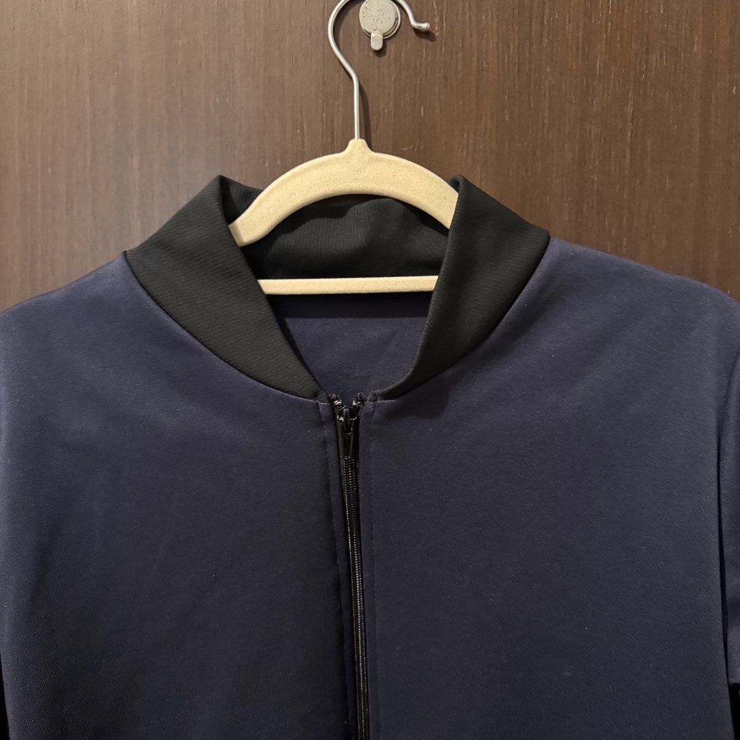 Navy Blue Bomber Jacket with Black Ribbed Trim (Category: Coats, Jackets and Outerwear) located in Quezon City. Submitted by ianne.declutter (Listing ID 1469455413, Image 2). Description: - Color: Dark Navy Blue - Details: Black ribbed collar, cuffs, and hem with full zip closure - Material: Smooth, lightweight fabric with clean stitching - Style: Great everyday outerwear that easily matches casual fits - Condition: Brand new / Excellent .