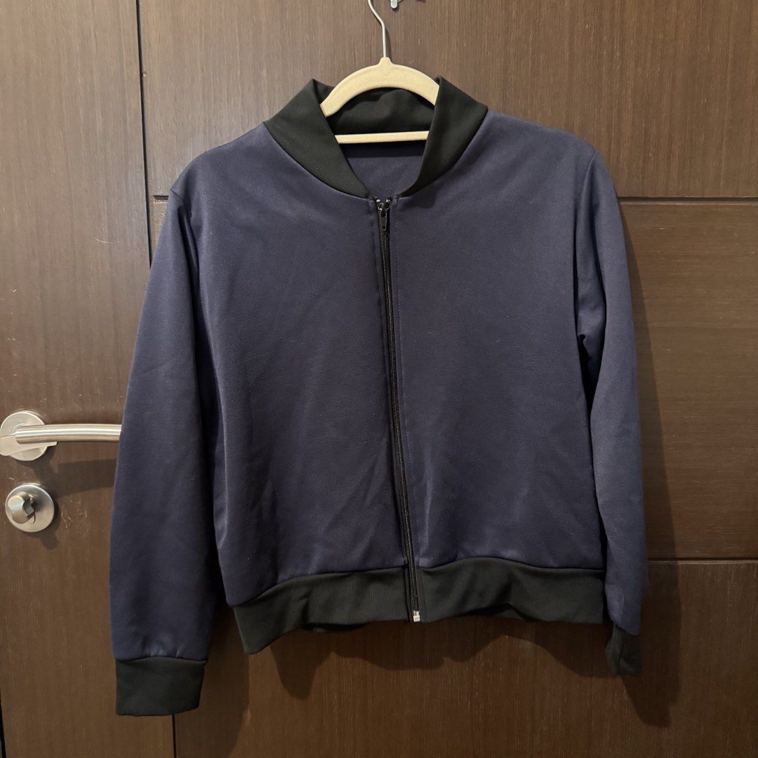 Navy Blue Bomber Jacket with Black Ribbed Trim (Category: Coats, Jackets and Outerwear) located in Quezon City. Submitted by ianne.declutter (Listing ID 1469455413, Image 3). Description: - Color: Dark Navy Blue - Details: Black ribbed collar, cuffs, and hem with full zip closure - Material: Smooth, lightweight fabric with clean stitching - Style: Great everyday outerwear that easily matches casual fits - Condition: Brand new / Excellent .