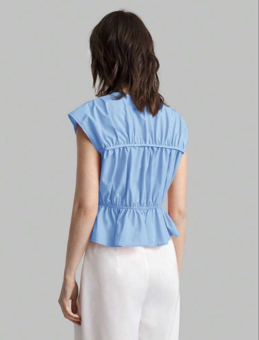 Navy Blue Tie-front Peplum Blouse (Category: Sleeveless) located in Mandaluyong City. Submitted by blzstr (Listing ID 1469430938, Image 3). Description: - Size small but fits medium nicely since garterized yung waist - Color: Navy blue - Multiple tie-front closures, cap sleeves with gathered shoulder/back details - Fitted waist with flared peplum hem - used once.