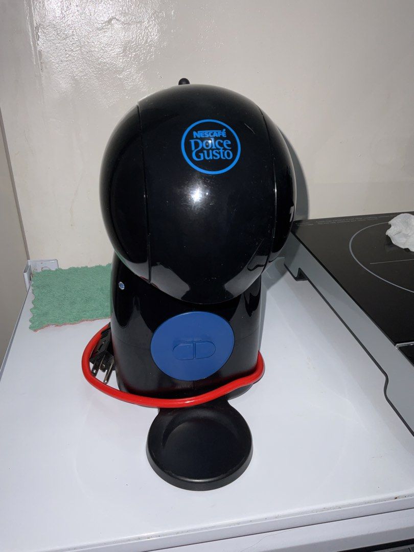 Nescafe Dolce Gusto Coffee Machine Black (Category: Coffee Machines & Makers) located in Makati City. Submitted by depolarize (Listing ID 1469508543, Image 1). Description: Nescafe Dolce Gusto Coffee Machine > Good Condition > No box > Issue: Missing drip tray but does not affect function. > Reason for selling: Already using another coffee machine. Nakatambak lang. > Will include reusable/refillable pod (used)..