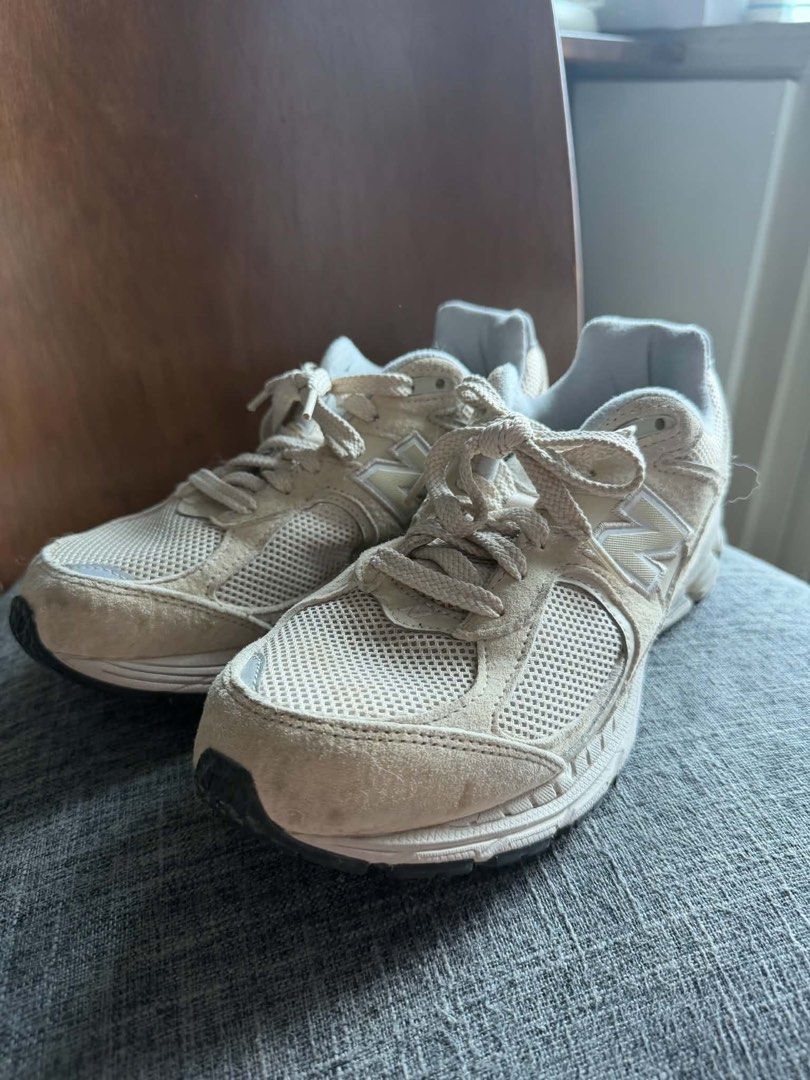 New Balance 2002RE Protection Pack Rain Cloud Beige (Category: Sneakers) located in Manila. Submitted by mialuna_ (Listing ID 1469425990, Image 3). Description: - Brand: New Balance 2002R - Color: Cream and beige - Size: US 8 Men / US 9.5 Women - Material: Suede and mesh upper panels - Features: Chunky sole unit, extremely comfortable - Condition: Pre-owned with visible wear on the toe and outsoles Unisex.