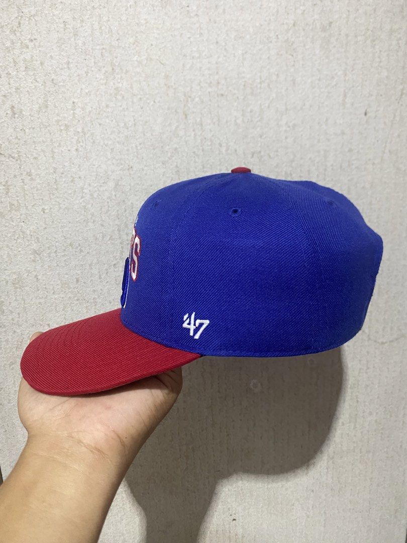 New York Giants '47 Brand Snapback Hat (Category: Caps & Hats) located in Puerto Princesa. Submitted by earlpogitrhift (Listing ID 1469441108, Image 2). Description: - Brand: '47 Brand - Team: New York Giants - Color: Royal blue crown with red brim and top button - Details: Embroidered NY and Giants logo on front, '47 logo on side - Fit: Adjustable strapback closure - Condition: Clean interior lining with original brand tags intact - Style: Ready