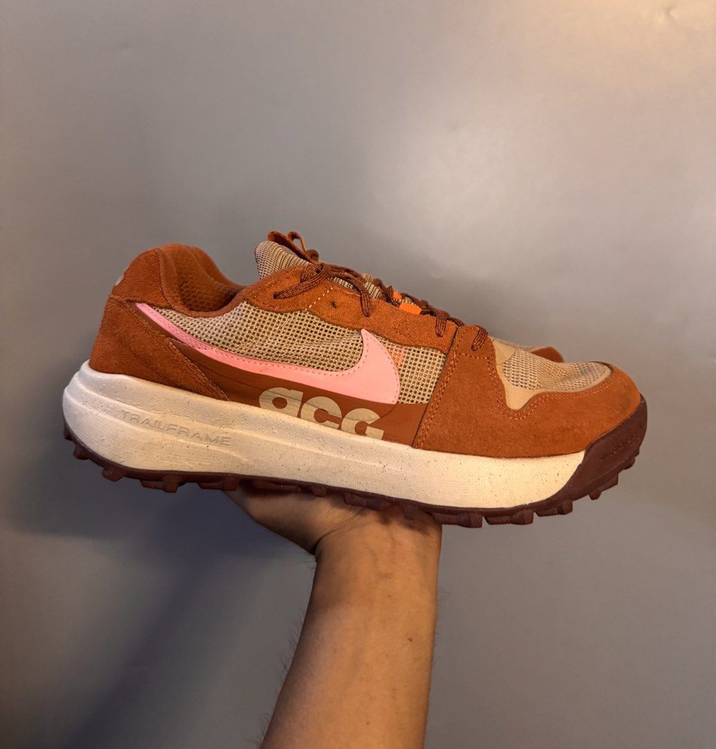 Nike ACG Lowcate Brown Pink Sneakers (Category: Sneakers) located in Alaminos. Submitted by outfitcheck.ph (Listing ID 1469512944, Image 2). Description: - Brand/Model: Nike ACG Lowcate - Colorway: Brown and Pink with pink Swoosh - Materials: Breathable mesh and durable suede upper - Sole: Trailframe unit with a textured outsole for superior grip - Branding: ACG logo on heel and tongue - Condition: 9.5/10 condition, worn only a couple of times wi
