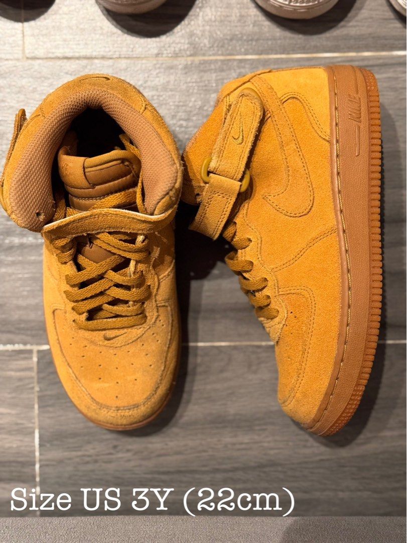 Nike Air Force 1 Mid Wheat Flax Size US 3Y (Category: Babies & Kids Fashion) located in Santa Maria. Submitted by baghoarder23 (Listing ID 1469543797, Image 1). Description: - Colorway: Wheat Flax - Style: Mid-top with velcro ankle strap - Material: Suede upper with gum rubber sole - Details: Perforated toe box and tonal stitching - Size: Youth US 3Y (22cm) - Condition: Clean overall appearance, matching laces included.