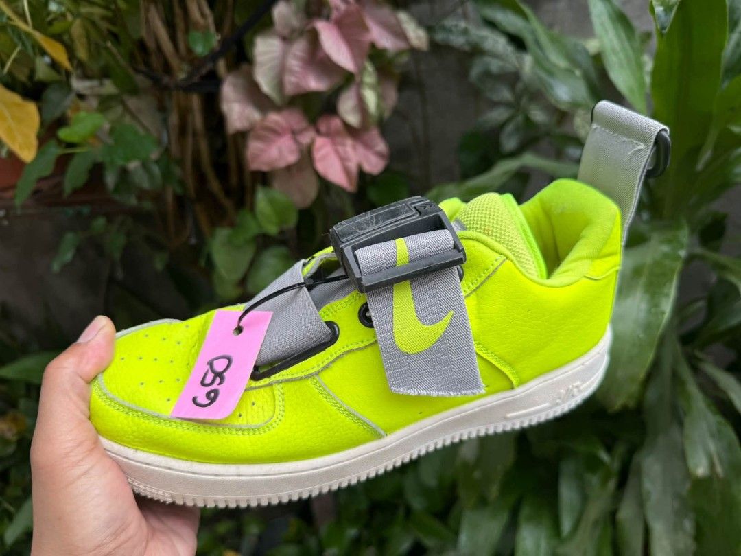 Nike Air Force 1 Utility Volt Black (Category: Sneakers) located in Manila. Submitted by amare_finds.ph (Listing ID 1469409192, Image 3). Description: - Model: Nike Air Force 1 Utility -US 8.5 men’s / Euro 42 / 26.5cm - Colorway: Neon Volt with black swoosh and classic white midsole - Material: Bright yellow tumbled leather - Features: Rugged utility strap system, heel pull tab, and exposed stitching details - Condition: Minor scuffing on the sid