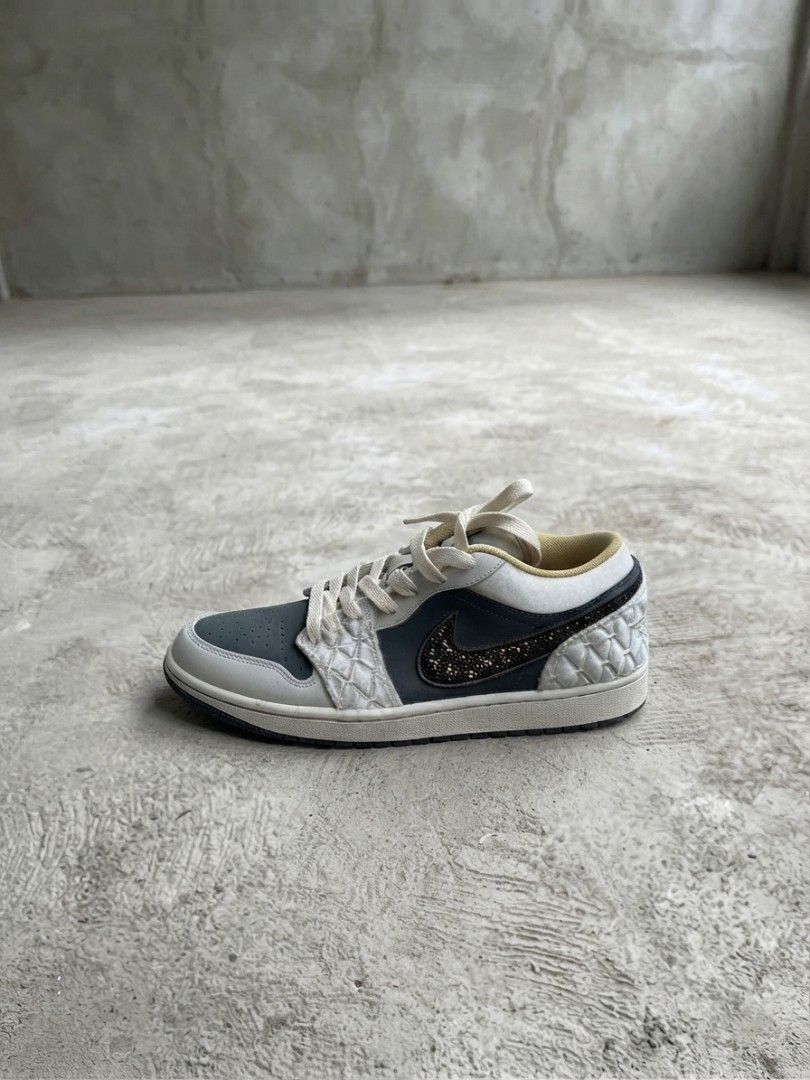 Nike Air Jordan 1 Low Quilted (Category: Sneakers) located in Manila. Submitted by realjude (Listing ID 1469435093, Image 2). Description: - Brand/Model: Nike Air Jordan 1 Low - Colorway: White and Dark Grey with matching cream laces and midsole - Design: Distinctive quilted side panels and overlays - Highlights: Sparkling crystal-embellished swoosh on the lateral side, smooth swoosh on the medial side - Condition: Clean overall condition with mi