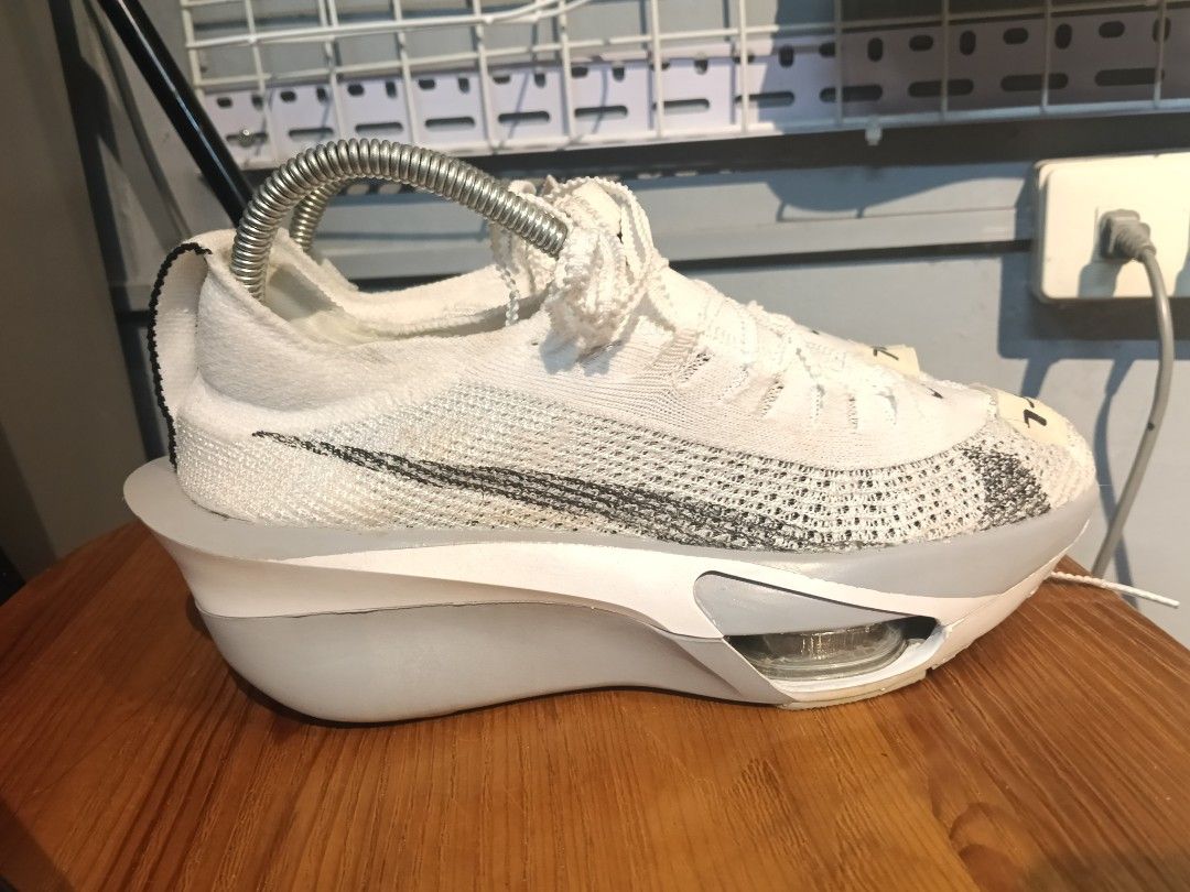Nike Alphafly 3 White Grey Size US 7 (Category: Sneakers) located in Manila. Submitted by mariarezap86451 (Listing ID 1469529697, Image 2). Description: - Brand/Model: Nike Running Shoes - Colorway: White and Grey - Size: US 7 / EUR 40 / UK 6 - Upper: Lightweight Flyknit - Cushioning: ZoomX foam with visible air pods in the forefoot - Ideal For: Marathons, speed training, and race days - Condition: Clean uppers and soles with minimal wear.