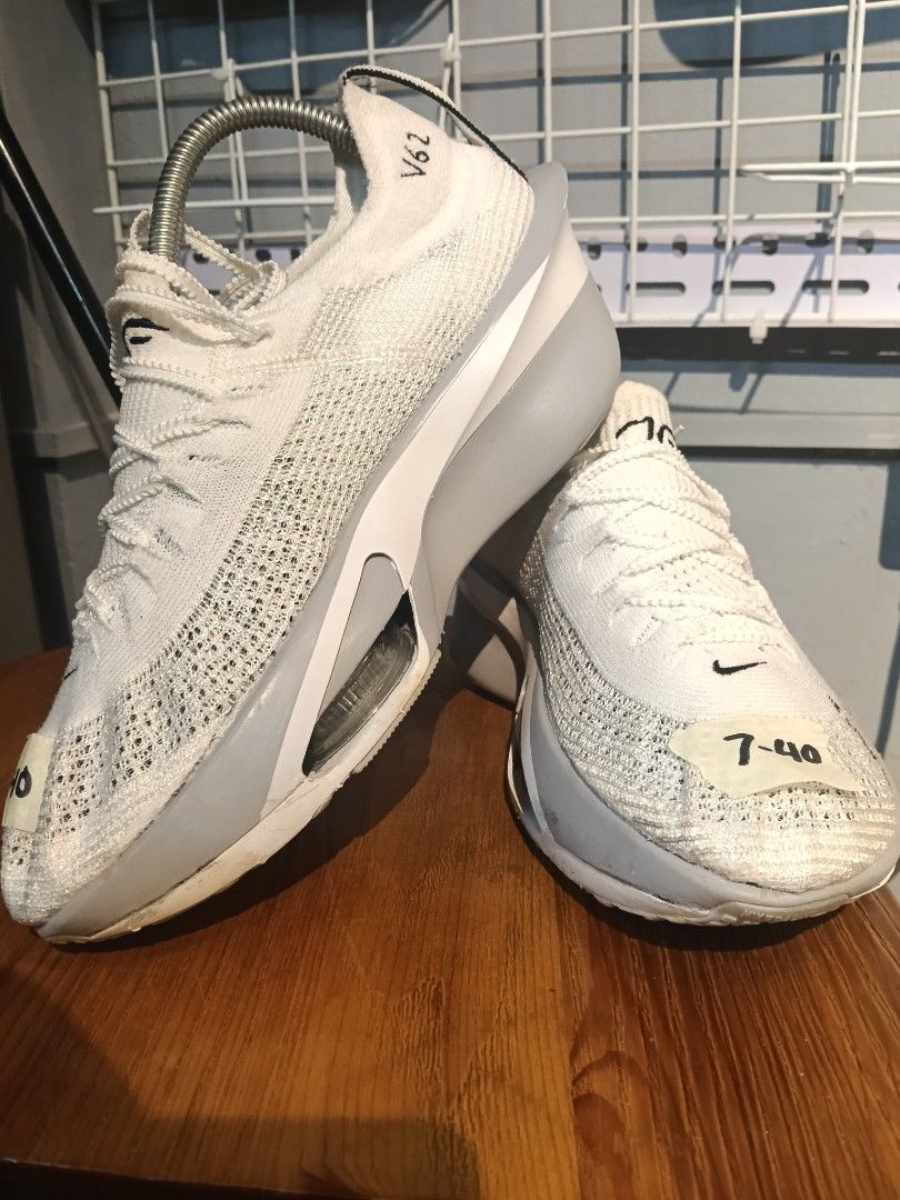 Nike Alphafly 3 White Grey Size US 7 (Category: Sneakers) located in Manila. Submitted by mariarezap86451 (Listing ID 1469529697, Image 3). Description: - Brand/Model: Nike Running Shoes - Colorway: White and Grey - Size: US 7 / EUR 40 / UK 6 - Upper: Lightweight Flyknit - Cushioning: ZoomX foam with visible air pods in the forefoot - Ideal For: Marathons, speed training, and race days - Condition: Clean uppers and soles with minimal wear.