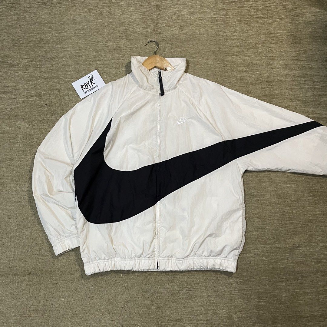 Nike Big Swoosh Windbreaker (Category: Coats, Jackets and Outerwear) located in Batangas. Submitted by reyr. (Listing ID 1469397736, Image 2). Description: Dimes: 24” width | 27.5” length Condition: Great Color rate: 9/10 Flaws: Unnoticeable stains.