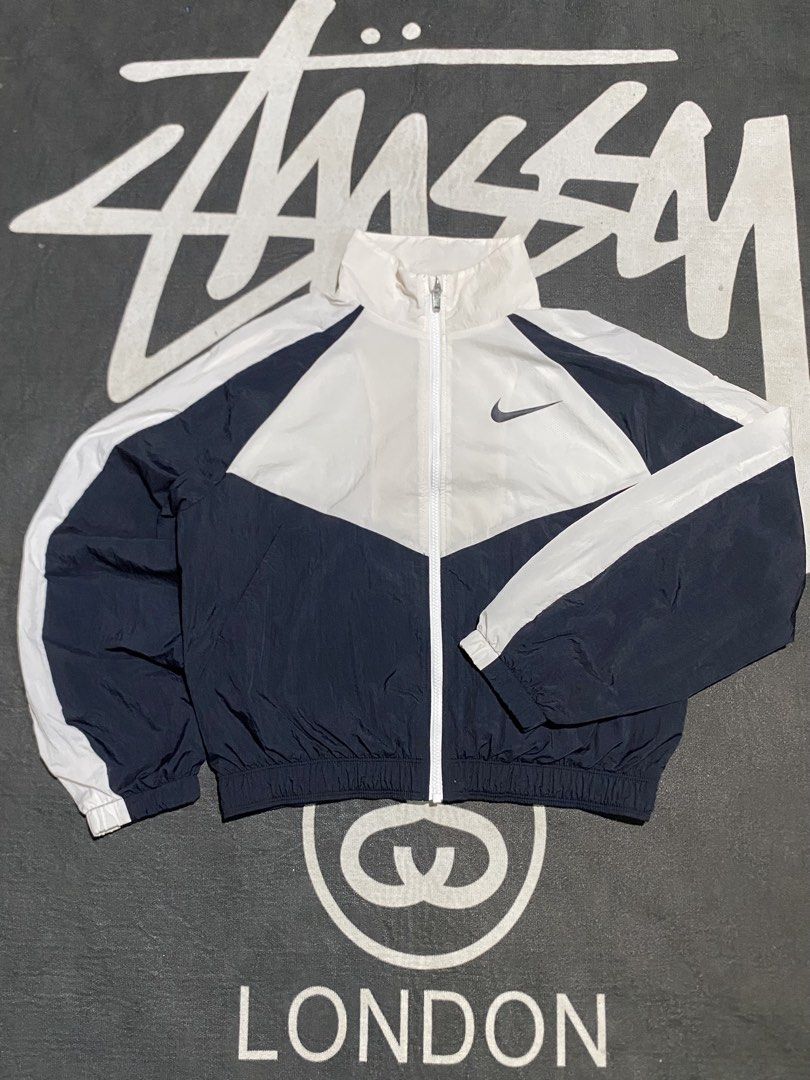 Nike big swoosh windbreaker (Category: Coats, Jackets and Outerwear) located in Andop. Submitted by trckmark4u (Listing ID 1469553476, Image 1). Description: Nike big swoosh Dimes21x24.5 Issue washable stain Ganda pa. Masyado Excellent condition .