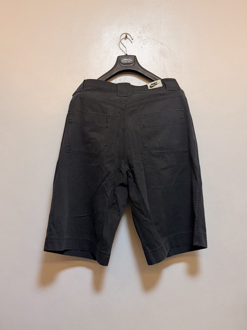 Nike Black Denim Cargo Shorts (Category: Shorts) located in Manila. Submitted by swiftgem.eeb06e (Listing ID 1469515489, Image 2). Description: - Brand: Nike - Color: Black denim - Size: XL - Material: Heavyweight cotton - Features: Multiple front and back pockets, embroidered Nike logo on lower left pocket, Nike patch on back waistband - Closure: Button and zipper fly - Origin: Made in Indonesia - Size: XL - Dims: 18.5 x 25in - Condition: 8/10 L