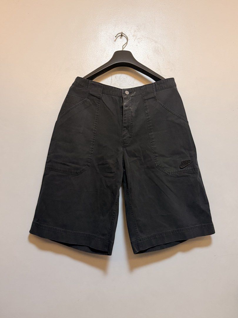 Nike Black Denim Cargo Shorts (Category: Shorts) located in Manila. Submitted by swiftgem.eeb06e (Listing ID 1469515489, Image 1). Description: - Brand: Nike - Color: Black denim - Size: XL - Material: Heavyweight cotton - Features: Multiple front and back pockets, embroidered Nike logo on lower left pocket, Nike patch on back waistband - Closure: Button and zipper fly - Origin: Made in Indonesia - Size: XL - Dims: 18.5 x 25in - Condition: 8/10 L