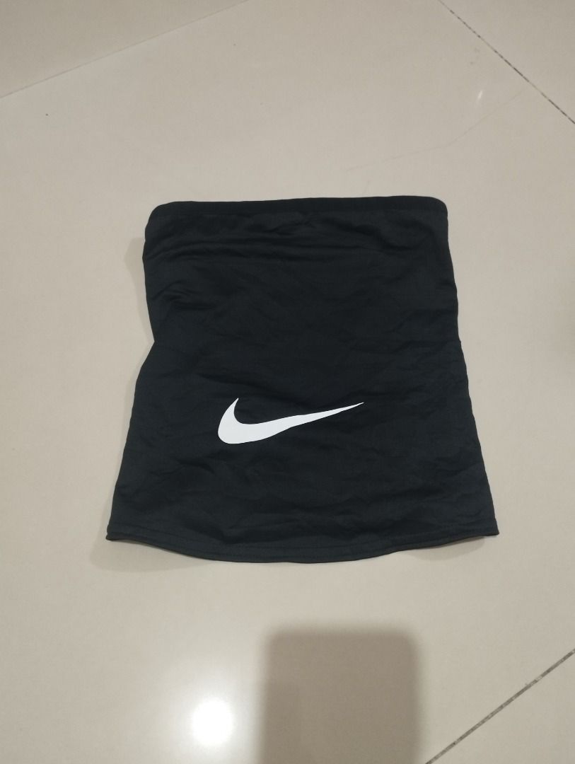 Nike Dri-FIT Neck Warmer Black One Size (Category: Scarves) located in Caloocan City. Submitted by jrdar (Listing ID 1469566496, Image 1). Description: - Brand: Nike - Style: Dri-FIT Neck Warmer / Snood - Color: Solid Black with white Nike swoosh logo - Size: One size fits most adults - Material: 91% polyester, 9% spandex - Features: Lightweight, sweat-wicking fabric ideal for cold weather workouts and runs - Condition: Clean inner tags attached.