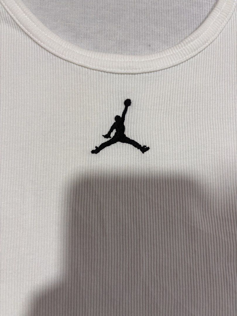 Nike Jordan White Ribbed Tank Top (Category: Sleeveless) located in Mabalacat. Submitted by _limitlessfashion (Listing ID 1469403696, Image 2). Description: - Brand: Nike Jordan - Color: White - Size: 3XL - Length 28.5 - Width 21 - No major issue, need wash only - Material: Dri-FIT technology fabric - Details: Ribbed texture, embroidered Jumpman logo on chest and upper back, small Jordan tag on lower hem - Condition: Clean and ready to wear.
