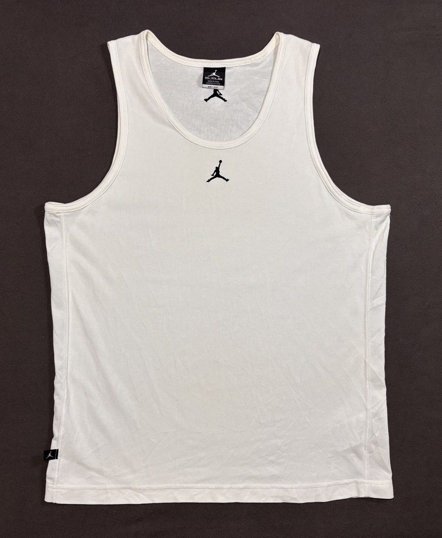 Nike Jordan White Ribbed Tank Top (Category: Sleeveless) located in Mabalacat. Submitted by _limitlessfashion (Listing ID 1469403696, Image 1). Description: - Brand: Nike Jordan - Color: White - Size: 3XL - Length 28.5 - Width 21 - No major issue, need wash only - Material: Dri-FIT technology fabric - Details: Ribbed texture, embroidered Jumpman logo on chest and upper back, small Jordan tag on lower hem - Condition: Clean and ready to wear.