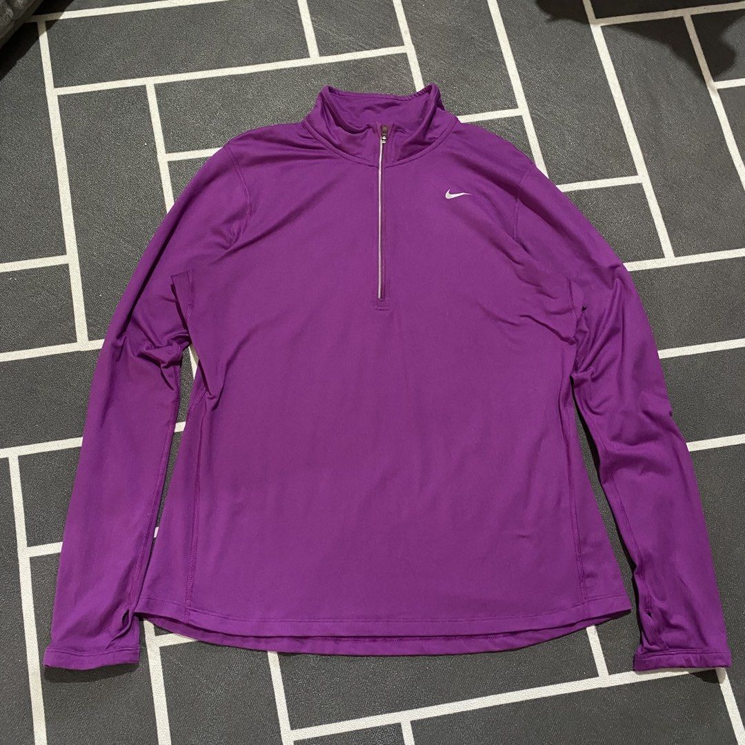 Nike Running Dri-fit Pacer (Category: Coats, Jackets and Outerwear) located in Villasis. Submitted by thriftngrind (Listing ID 1469435548, Image 1). Description: - Brand: Nike - Color: Purple - Dimension: 21 Width X 26 Length - Style: Long sleeve running pullover with half-zip neck and metallic swoosh logo - Features: Convenient thumbholes at cuffs - Fabric: Lightweight and stretchy for active wear .
