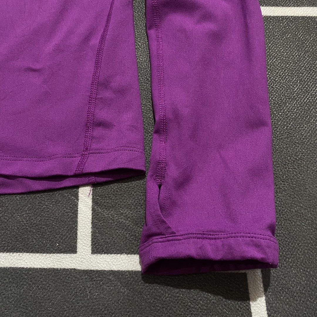 Nike Running Dri-fit Pacer (Category: Coats, Jackets and Outerwear) located in Villasis. Submitted by thriftngrind (Listing ID 1469435548, Image 3). Description: - Brand: Nike - Color: Purple - Dimension: 21 Width X 26 Length - Style: Long sleeve running pullover with half-zip neck and metallic swoosh logo - Features: Convenient thumbholes at cuffs - Fabric: Lightweight and stretchy for active wear .