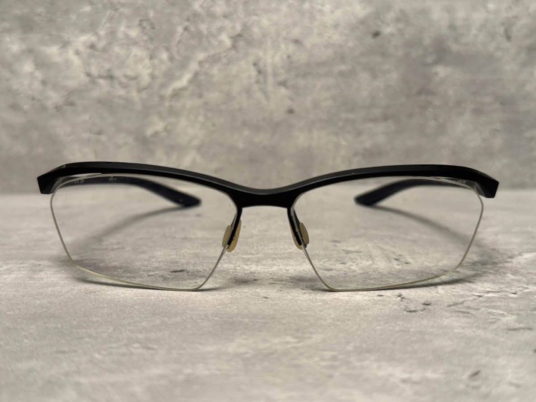 Nike semi-rimless glasses with case (Category: Sunglasses & Eyewear) located in Baguio. Submitted by gokubusansan (Listing ID 1469559964, Image 2). Description: - Brand: Nike - Frame Type: Semi-rimless - Color: Black with yellow temple accents - Logo: Subtle Nike swoosh on the side - Lenses: Clear (ready for your prescription lenses) you can have it replaced with pop-in replacement lenses - Inclusions: Matching black hardshell case with silver Ni